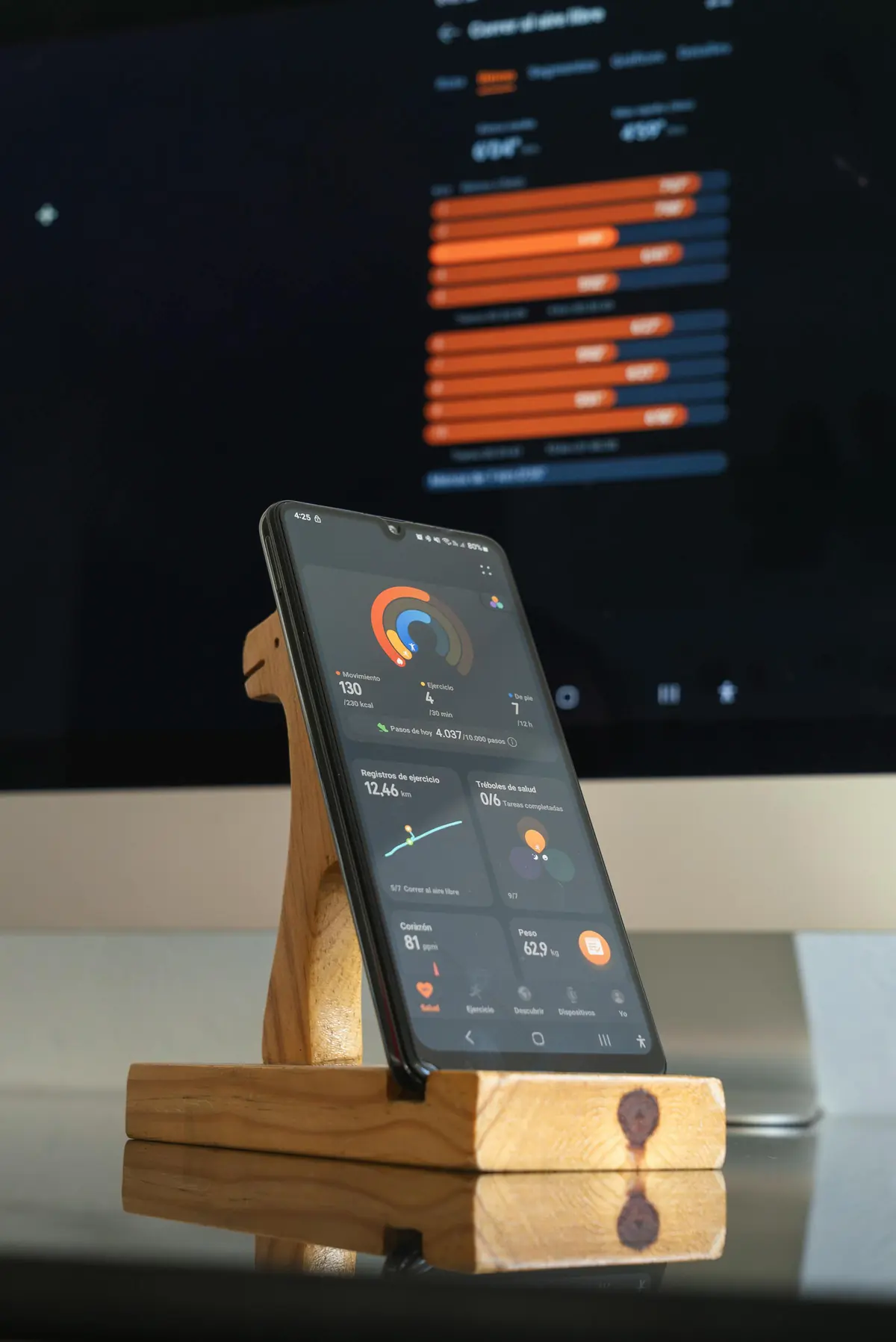 Smartphone showing fitness tracker app with progress charts - a MyFitnessPal alternative